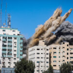An Israeli airstrike destroys a high-rise building in Gaza City, Gaza Strip, that housed media outlets including The Associated Press and Al Jazeera.